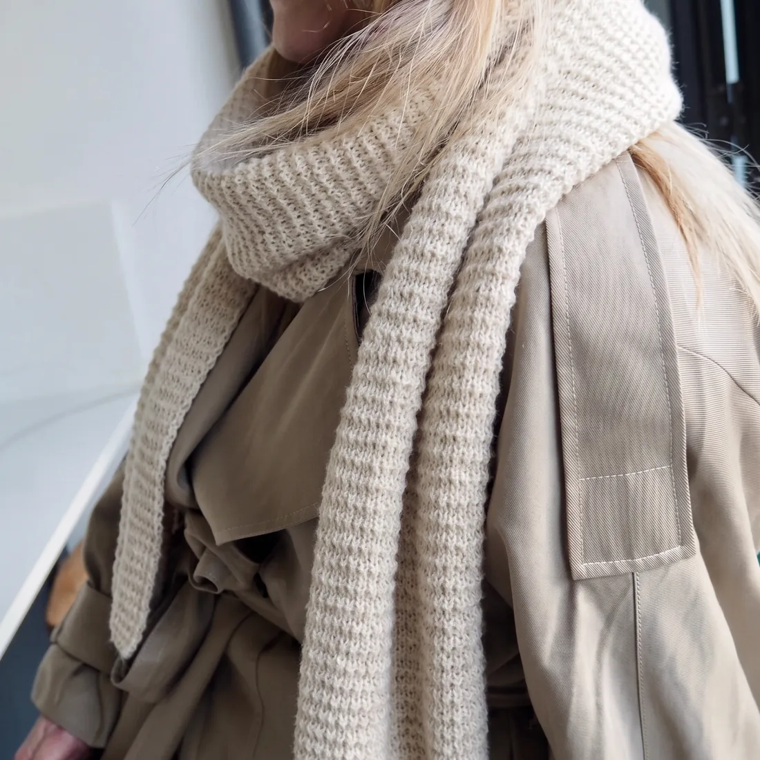 Natural cream baby alpaca waffle knit scarf softly wrapped over a neutral coat