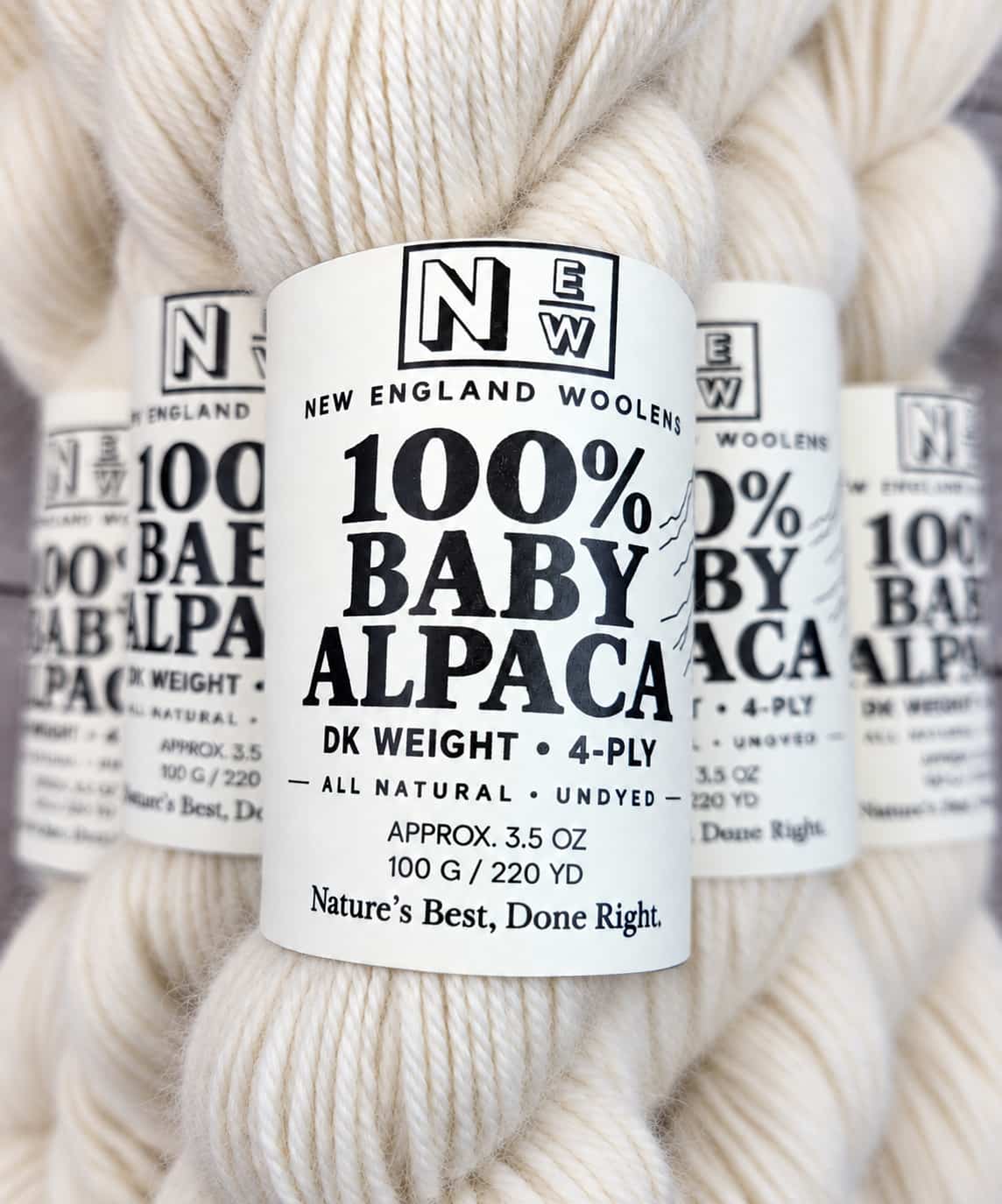 Multiple skeins of undyed natural white baby alpaca DK yarn